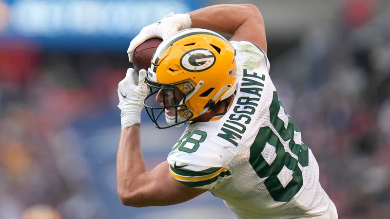Green Bay Packers tight end Luke Musgrave catches deep pass from quarterback Jordan Love...