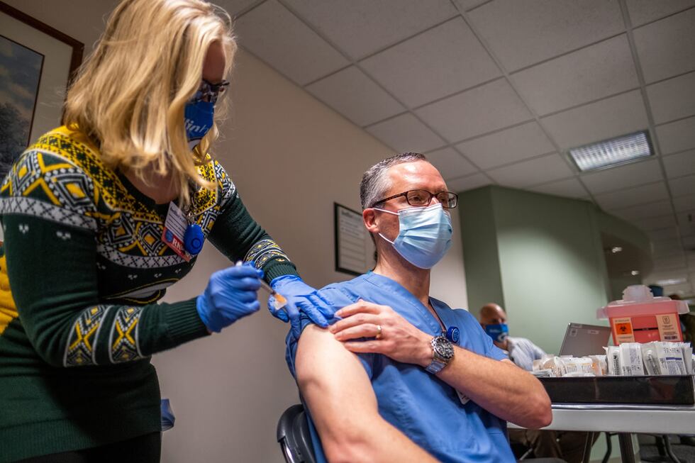 Bellin Health infectious disease specialist Dr. Michael Landrum receives the health system’s...