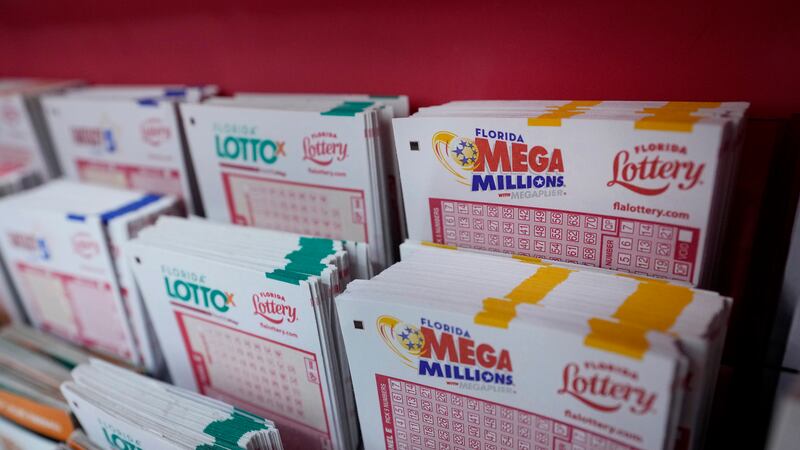 FILE - Lottery forms are seen, Aug. 7, 2023, at the Presidente Supermarket in the Little...