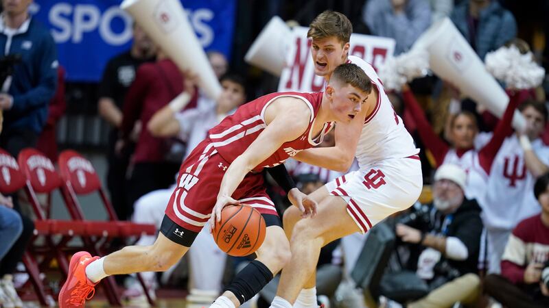 Wisconsin's Connor Essegian (3) goes to the basket against Indiana's Miller Kopp (12) during...