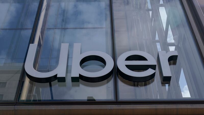 FILE - An Uber sign is displayed at the company's headquarters in San Francisco, Monday, Sept....