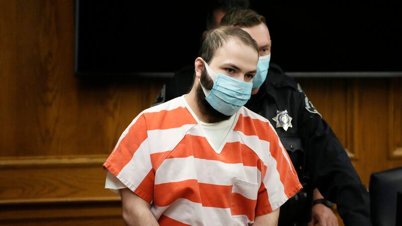 FILE - Ahmad Al Aliwi Alissa is led into a courtroom for a hearing, Sept. 7, 2021, in Boulder,...