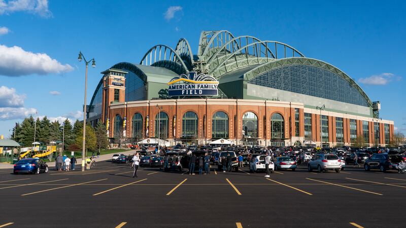 Fans are seen outside American Family Field before a baseball game between the Milwaukee...