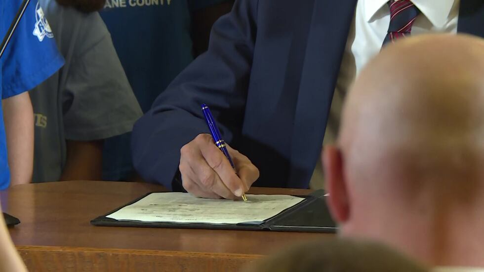 Gov. Tony Evers signs the biennial budget