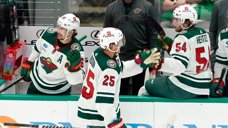 Minnesota Wild defenseman Jonas Brodin (25) is congratulated by Mats Zuccarello (36) and Sam...