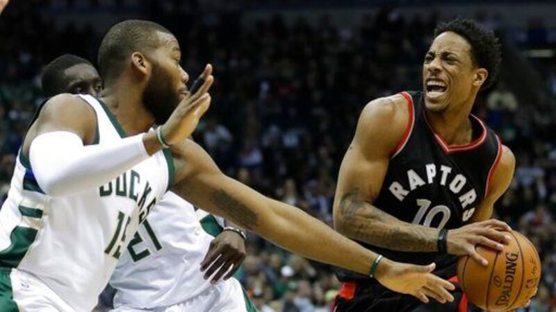 (AP Photo/Morry Gash). Toronto Raptors' DeMar DeRozan drives against Milwaukee Bucks' Greg...